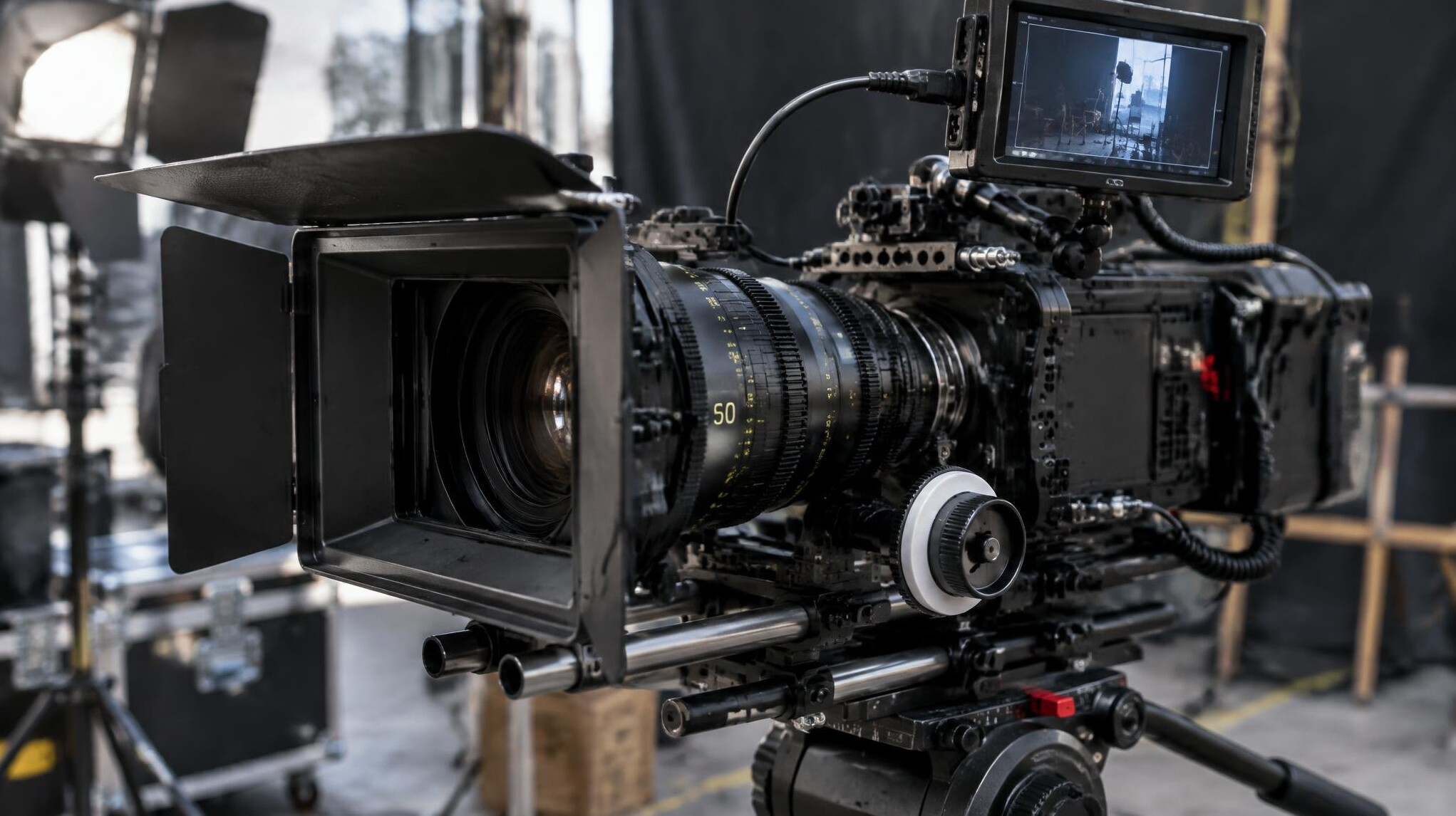 Film camera rig with lens and monitor on a set