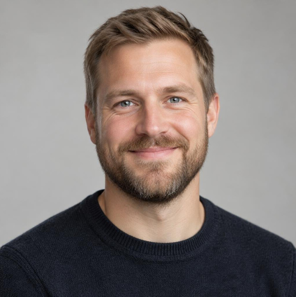 Portrait of a smiling bearded man in casual clothes